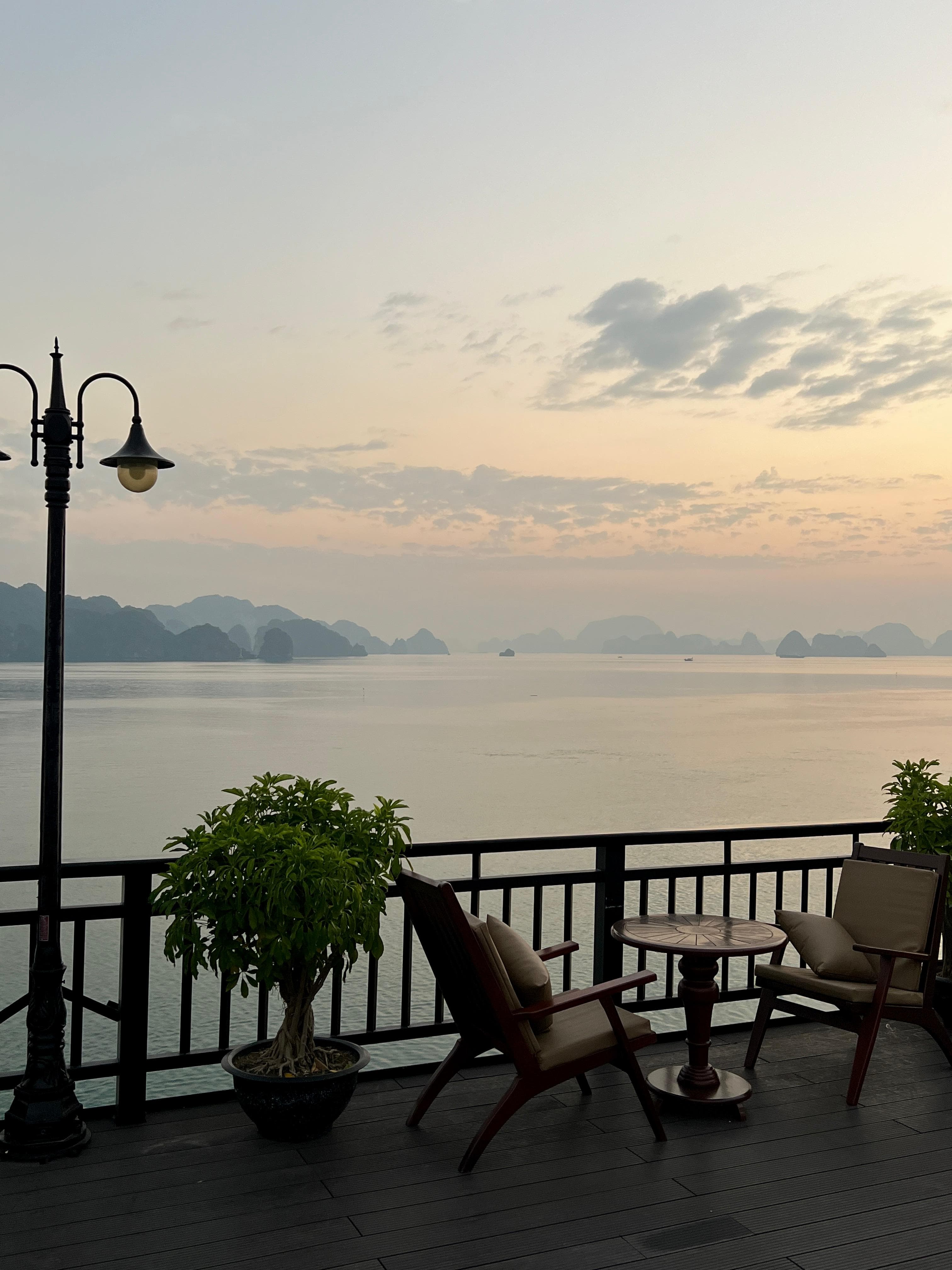 Terrace overlooking a misty bay at dawn